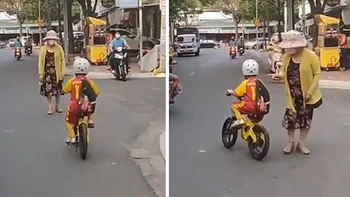 Bé trai làm người phụ nữ hết hồn trước pha bẻ cua xe đạp