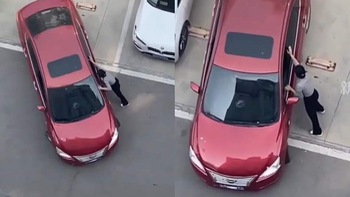 Nữ tài xế oằn mình đẩy ô tô vào 'chuồng'