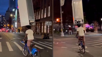 Đội tủ lạnh trên đầu đi xe đạp giữa phố New York