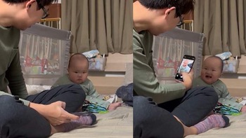 Em bé thay đổi biểu cảm 180 độ khi bố giơ điện thoại chụp ảnh