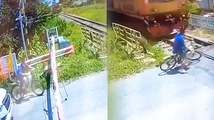 Video: Lên án người đàn ông phóng xe qua đường ray khi đoàn tàu đang tới